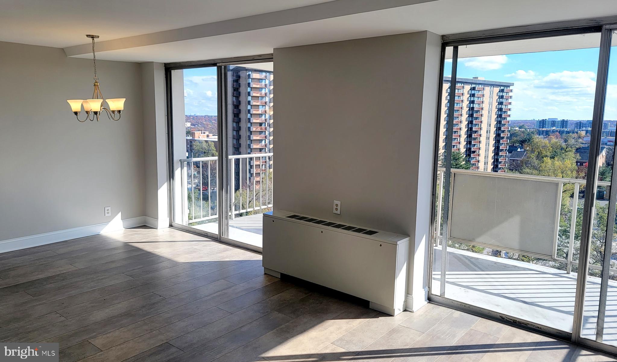 301 North Beauregard Street, Unit 903 Alexandria, VA 22312 - Photo 9 of 19 a view of a big room with wooden floor and windows