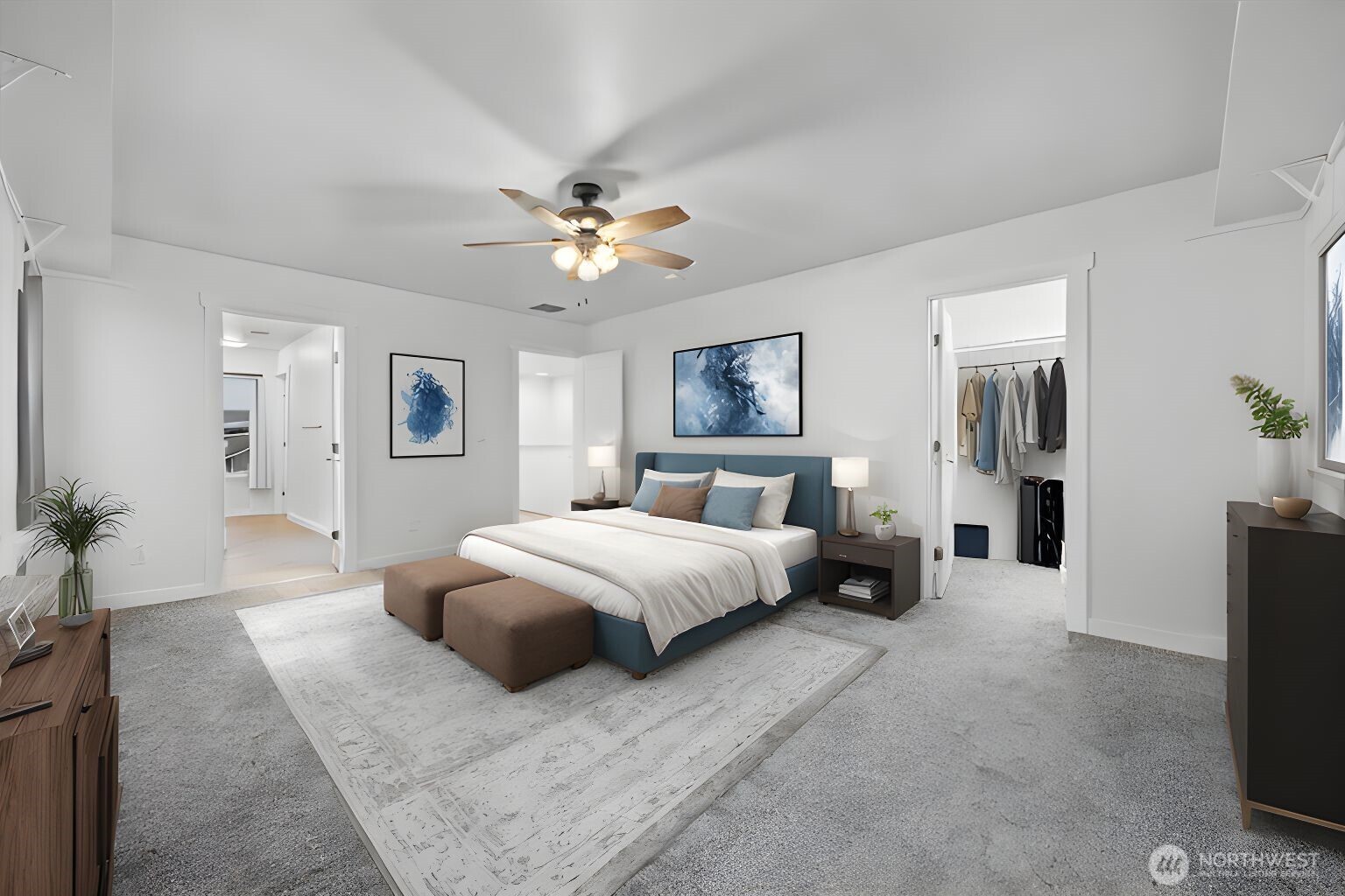 4333 Northwest Commons Drive Pasco, WA 99301 - Photo 16 of 25 a spacious bedroom with a large bed and a chandelier