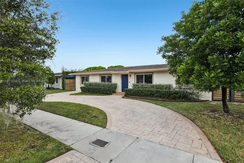 a view of house with outdoor space and tree s