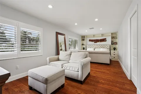 a bathroom with a granite countertop sink a toilet and a mirror