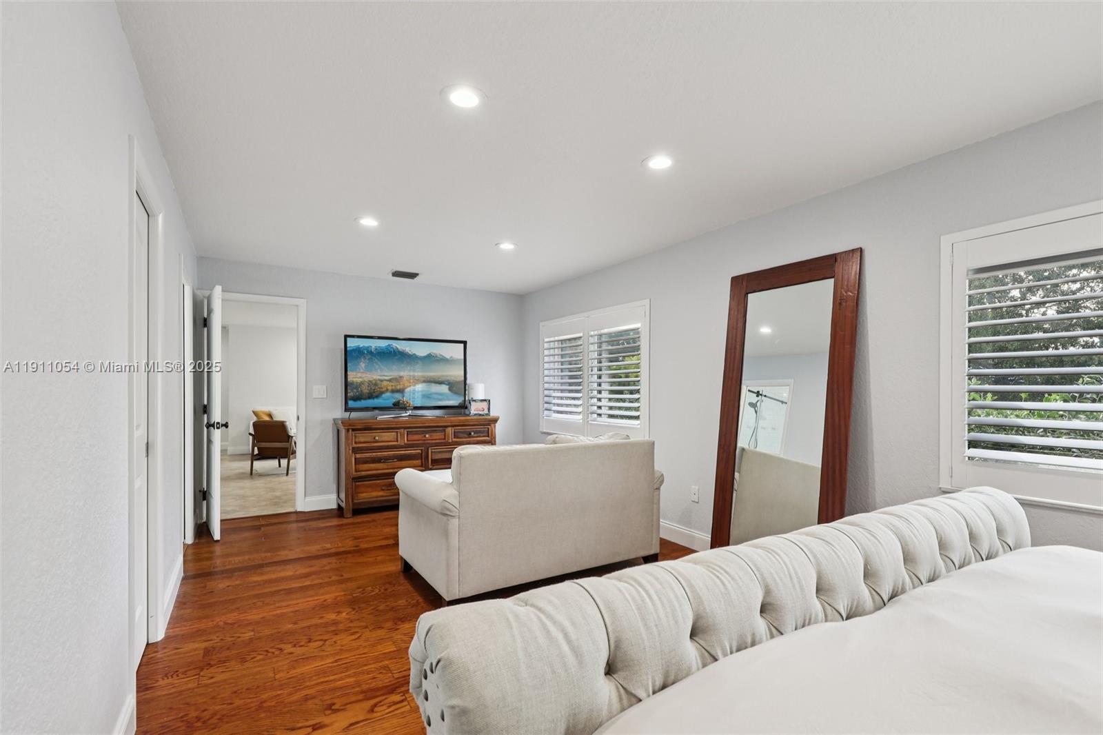 6721 Southwest 135th Avenue Miami, FL 33183 - Photo 24 of 66 a living room with furniture and a large window