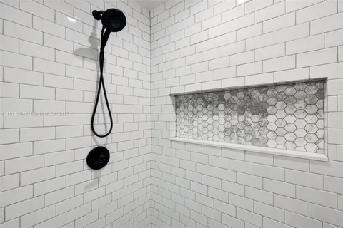 a bedroom with furniture and a wooden floor