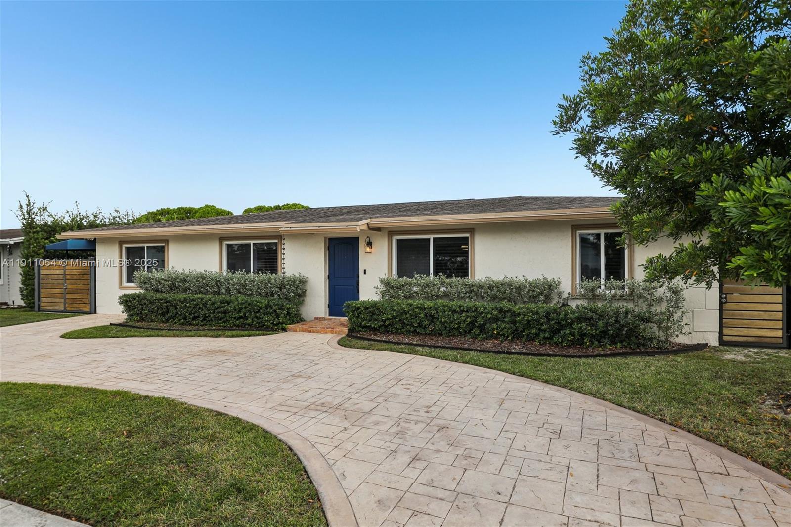 6721 Southwest 135th Avenue Miami, FL 33183 - Photo 3 of 66 a front view of a house with a yard