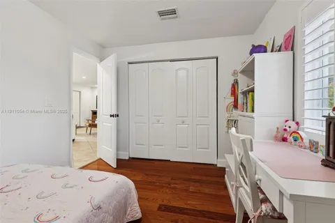 a view of a porch with furniture and a yard