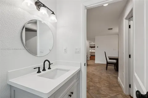 a view of a porch and garden