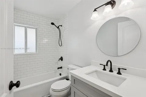 an aerial view of multiple houses with yard