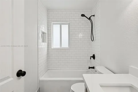 an aerial view of multiple houses with yard