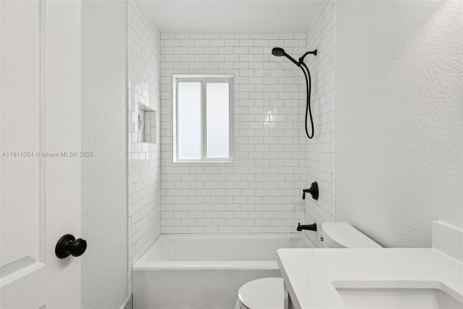 6721 Southwest 135th Avenue Miami, FL 33183 - Photo 38 of 66 a bathroom with a shower bathtub and toilet