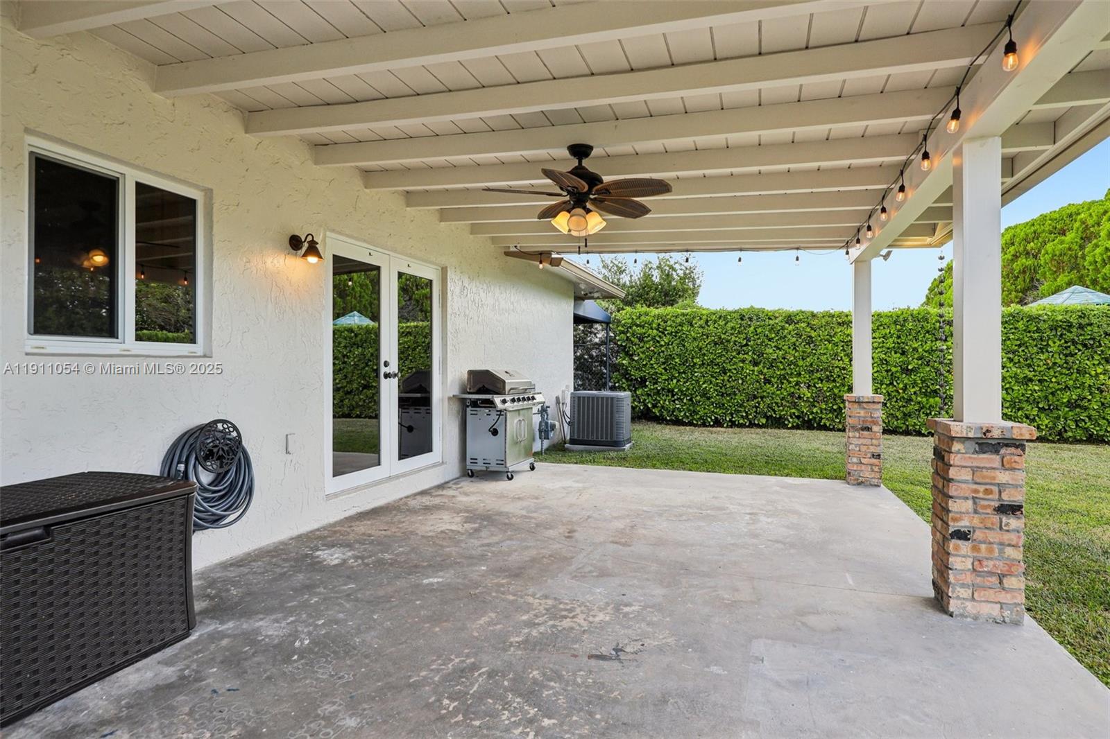6721 Southwest 135th Avenue Miami, FL 33183 - Photo 41 of 66 a view of a porch with furniture and a yard