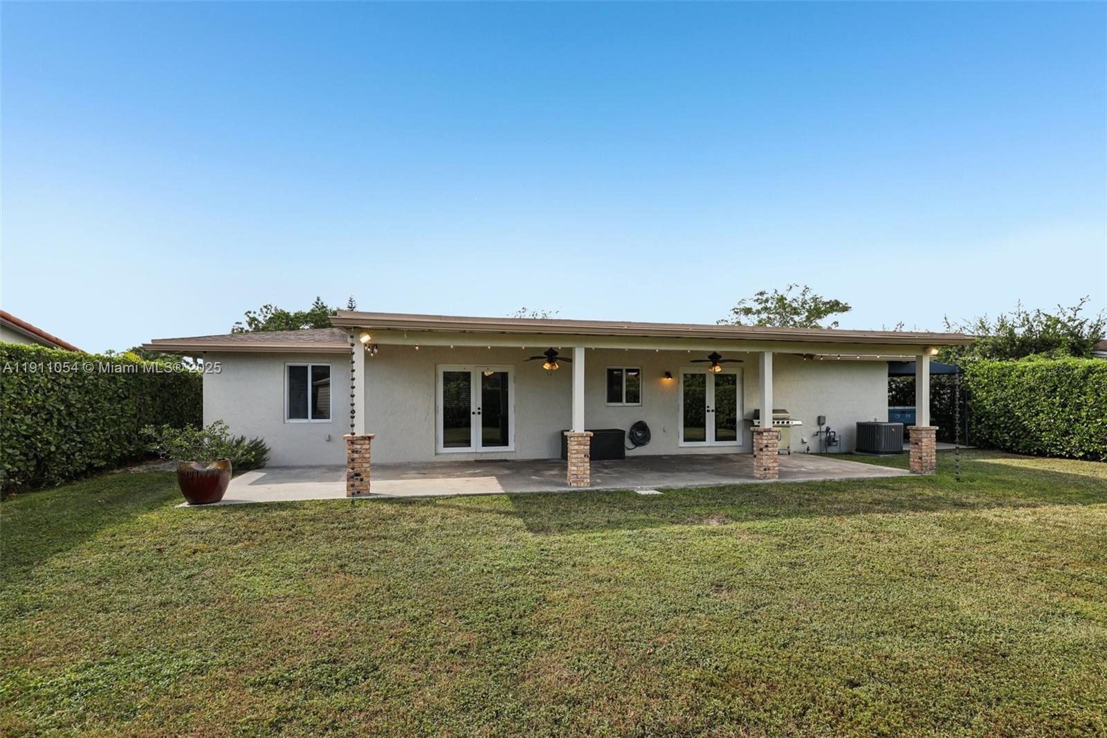 6721 Southwest 135th Avenue Miami, FL 33183 - Photo 44 of 66 a front view of house with yard and seating area
