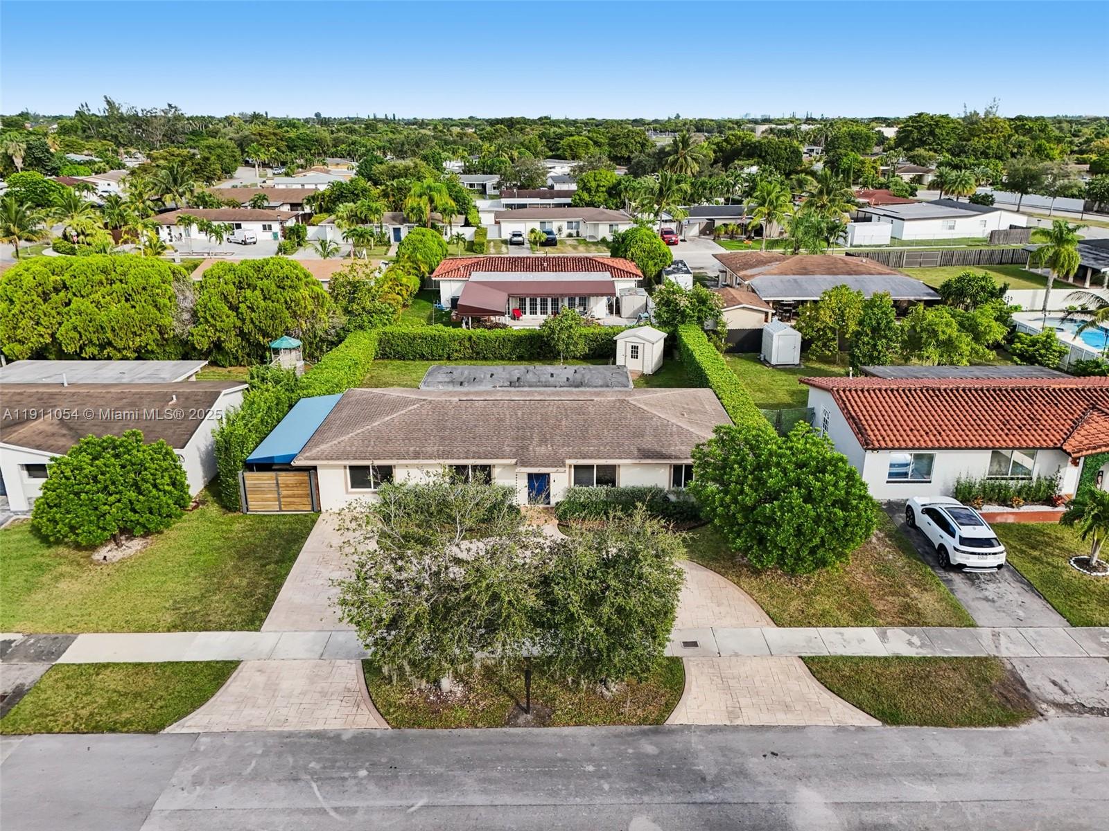 6721 Southwest 135th Avenue Miami, FL 33183 - Photo 49 of 66 an aerial view of multiple houses with yard