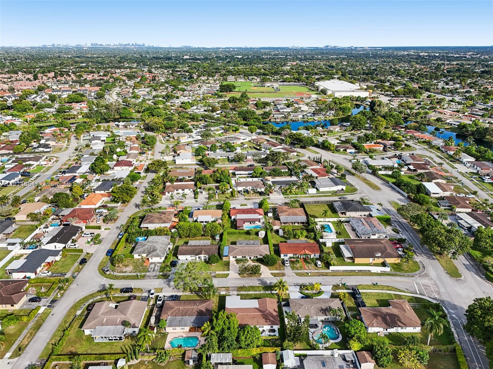 6721 Southwest 135th Avenue Miami, FL 33183 - Photo 53 of 66 an aerial view of residential houses with outdoor space