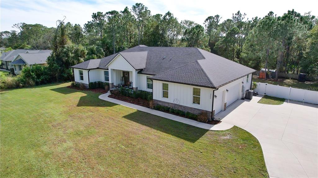 3262 Pheasant Trail Mims, FL 32754 - Photo 11 of 79 a aerial view of a house with a yard patio and backyard
