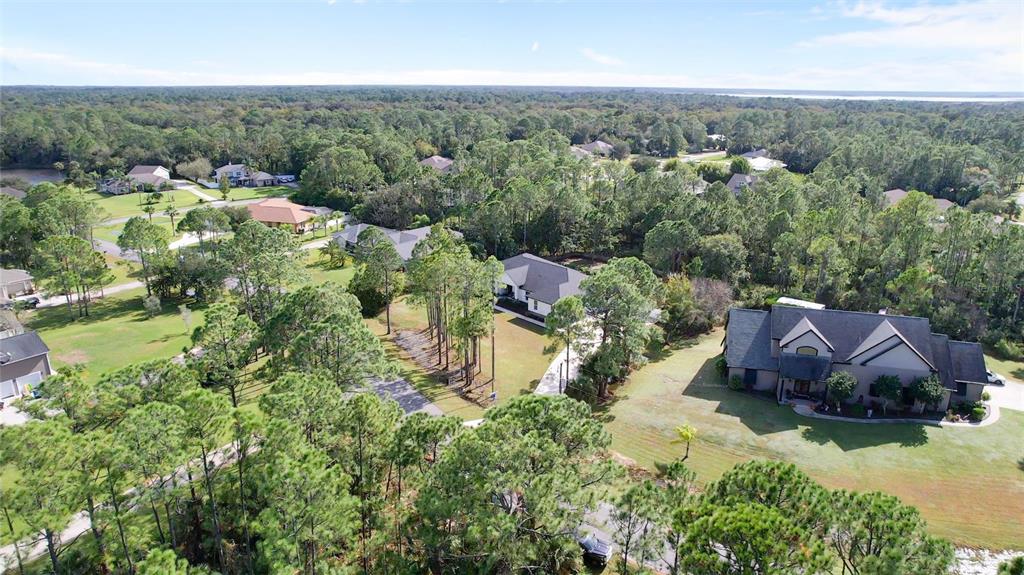 3262 Pheasant Trail Mims, FL 32754 - Photo 14 of 79 an aerial view of a house with a yard basket ball court and outdoor seating
