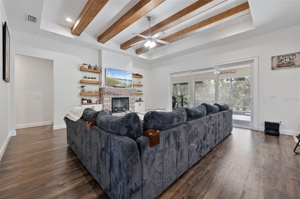 3262 Pheasant Trail Mims, FL 32754 - Photo 15 of 79 a living room with furniture and a fireplace
