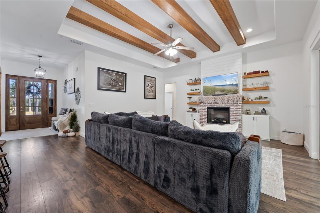 3262 Pheasant Trail Mims, FL 32754 - Photo 16 of 79 a living room with furniture and a fireplace