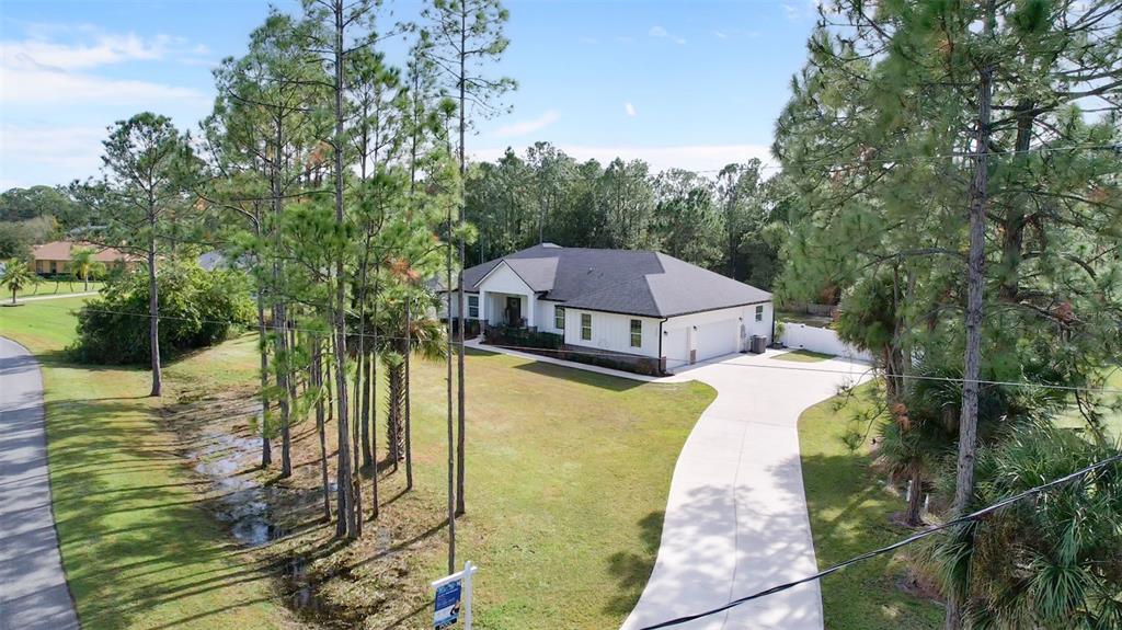 3262 Pheasant Trail Mims, FL 32754 - Photo 2 of 79 a view of a house with a small yard