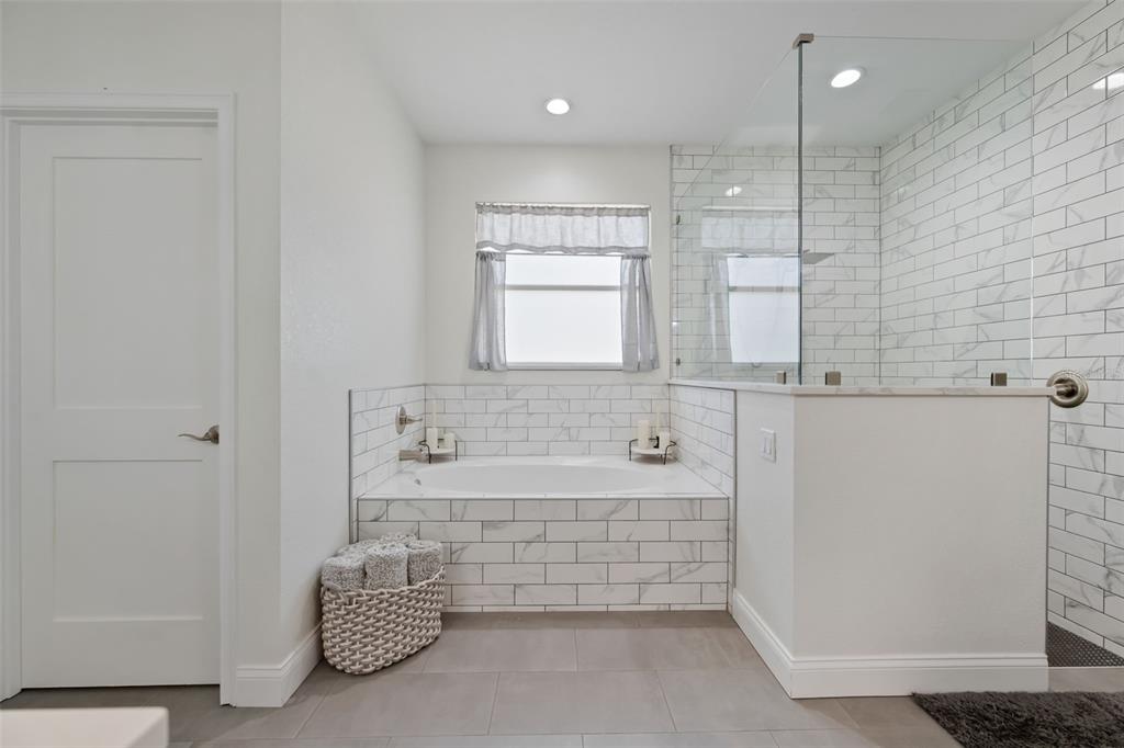 3262 Pheasant Trail Mims, FL 32754 - Photo 22 of 79 a bathroom with a bathtub and a shower