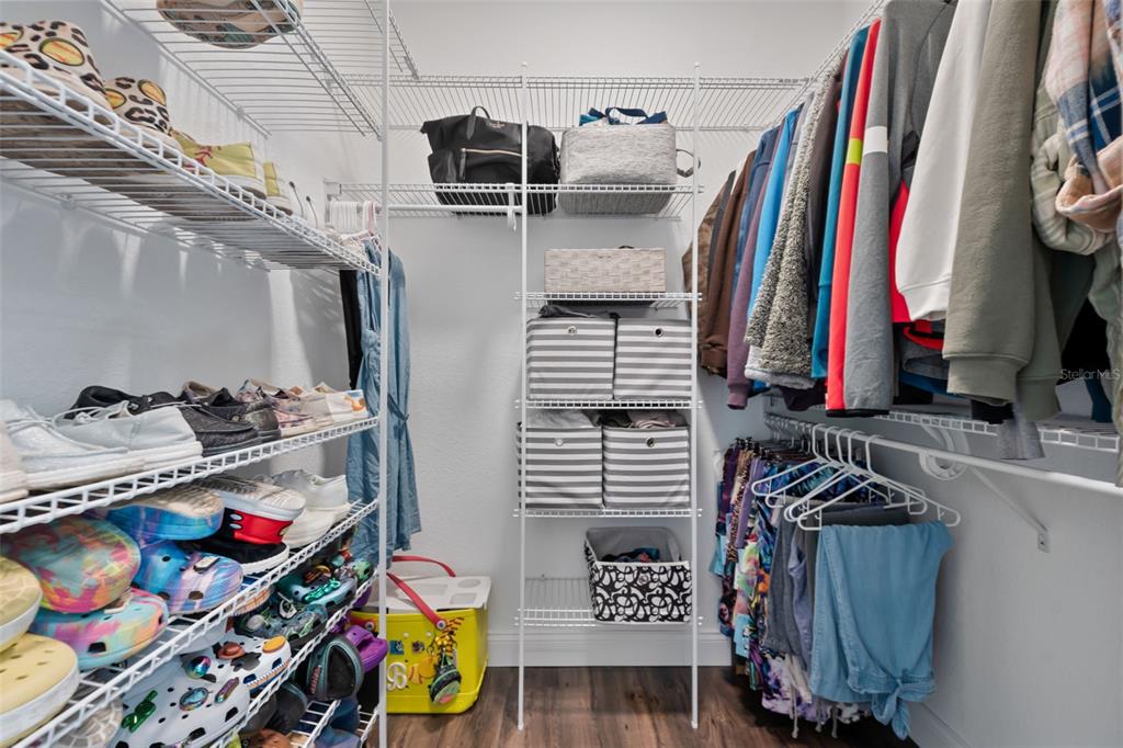 3262 Pheasant Trail Mims, FL 32754 - Photo 23 of 79 a view of walk in closet with clothes and shoes