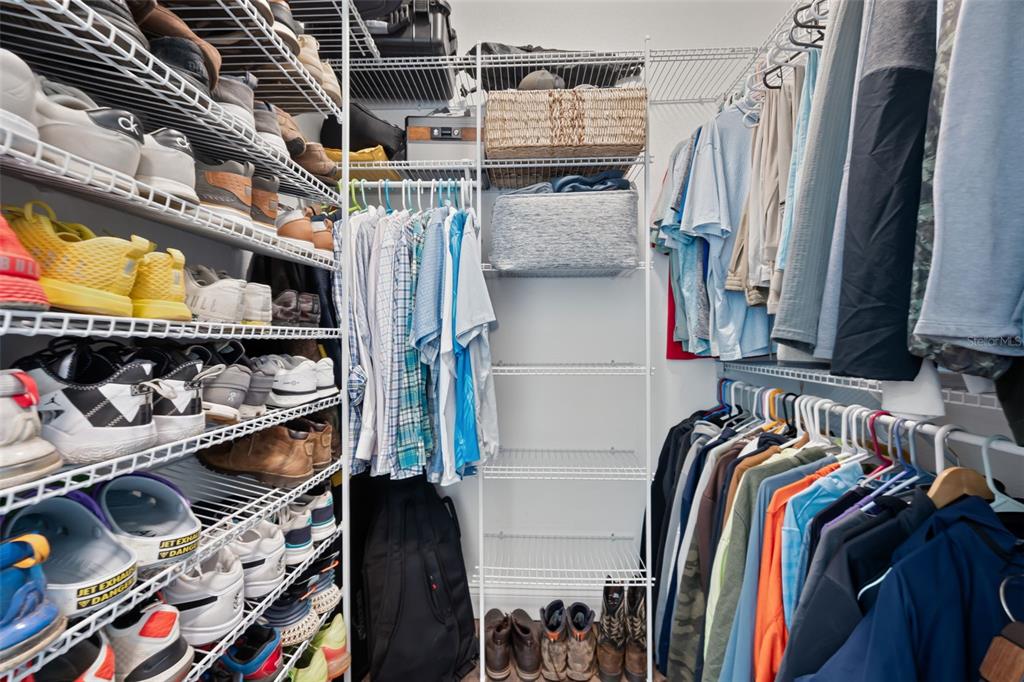 3262 Pheasant Trail Mims, FL 32754 - Photo 24 of 79 a view of walk in closet with clothes and shoes