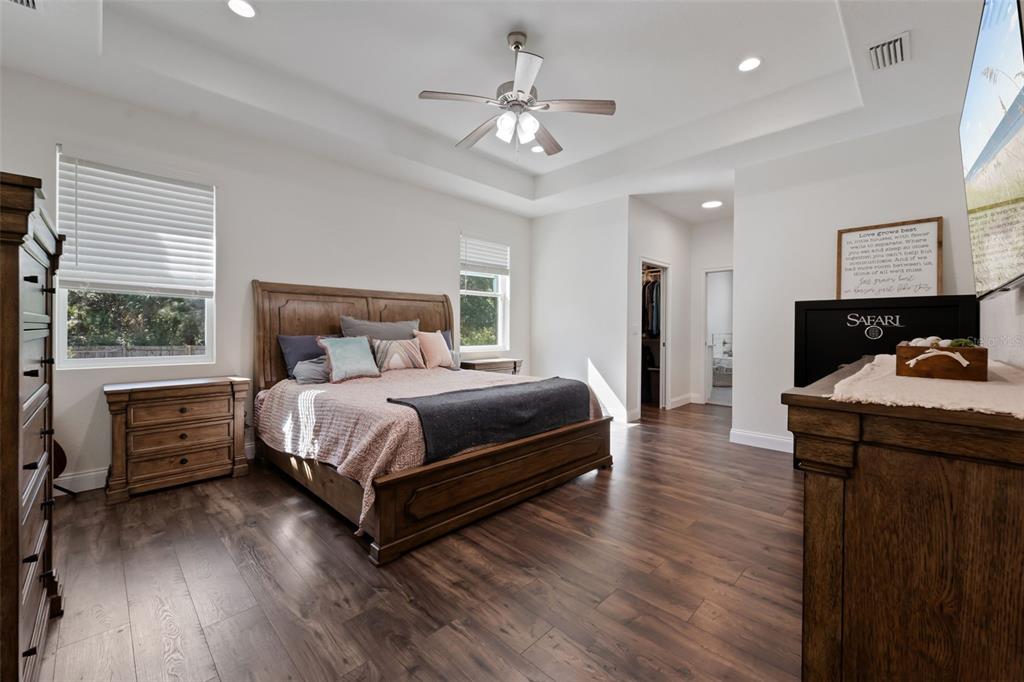 3262 Pheasant Trail Mims, FL 32754 - Photo 25 of 79 a bedroom with a bed and wooden floor