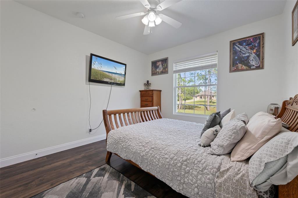 3262 Pheasant Trail Mims, FL 32754 - Photo 26 of 79 a bedroom with a bed and a window