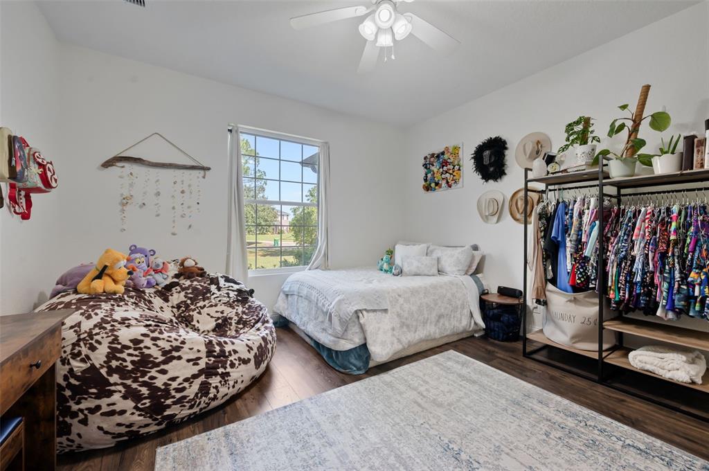 3262 Pheasant Trail Mims, FL 32754 - Photo 29 of 79 a bedroom with bed and a window
