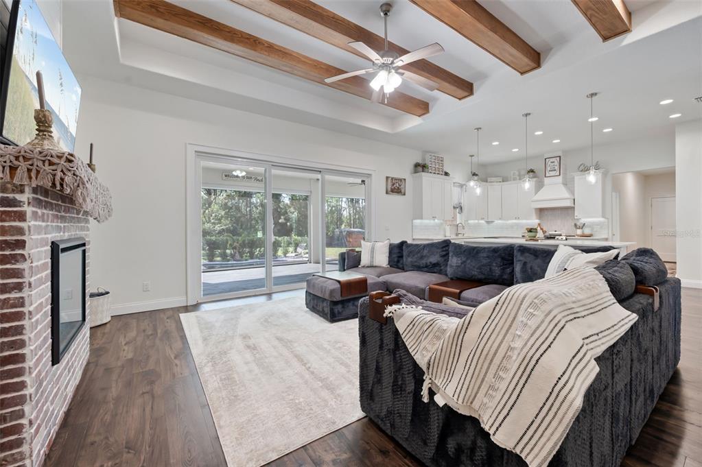 3262 Pheasant Trail Mims, FL 32754 - Photo 45 of 79 a large bedroom with bed and a large window with kitchen view