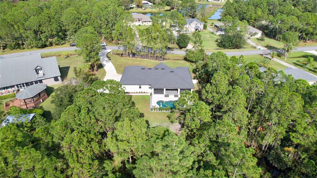 3262 Pheasant Trail Mims, FL 32754 - Photo 5 of 79 an aerial view of a house with yard swimming pool and outdoor seating