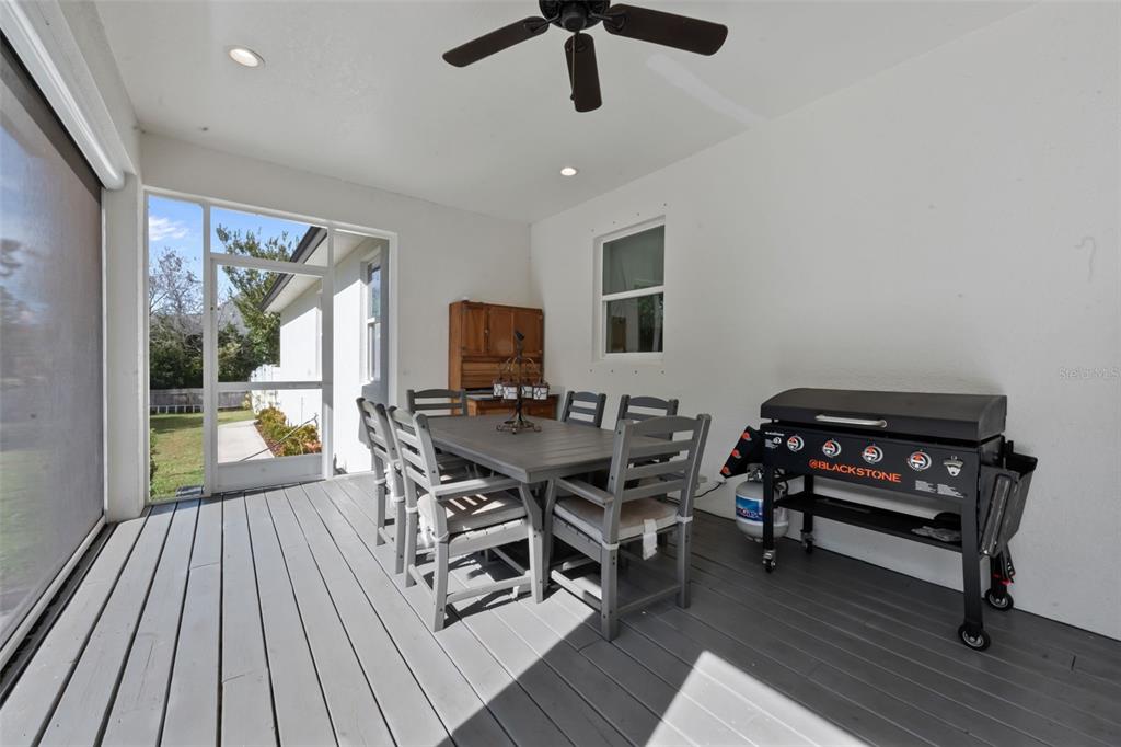 3262 Pheasant Trail Mims, FL 32754 - Photo 53 of 79 a living room with furniture a window and a flat screen tv