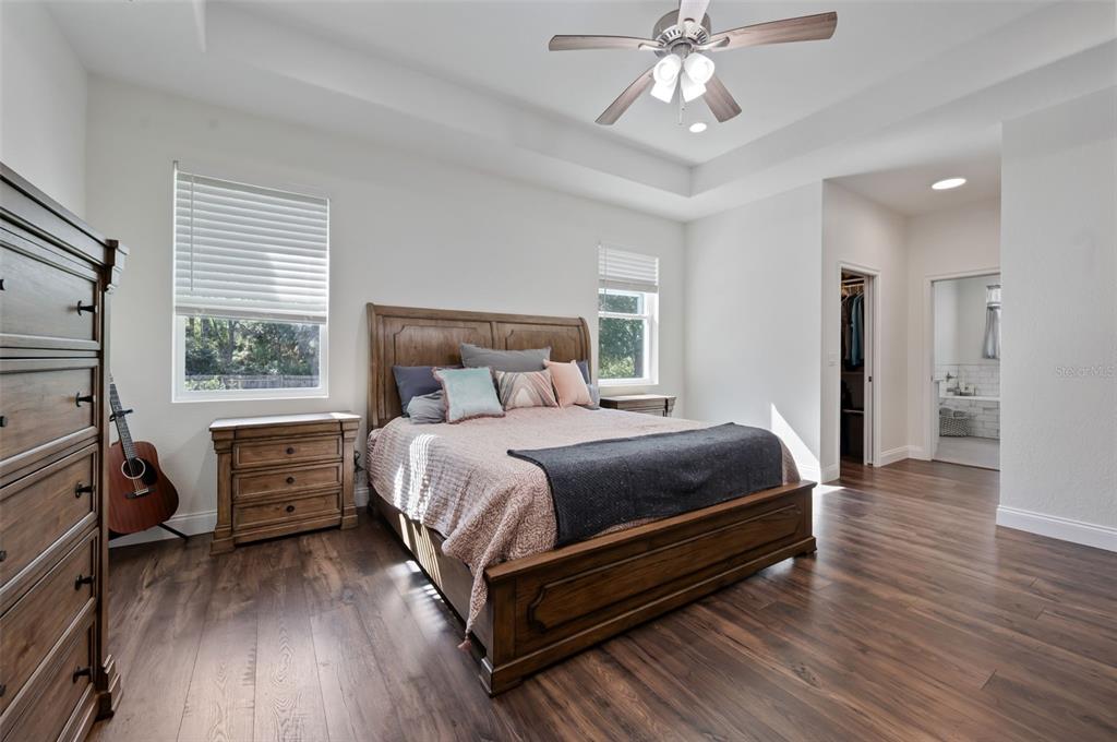 3262 Pheasant Trail Mims, FL 32754 - Photo 59 of 79 a bedroom with a bed and wooden floor