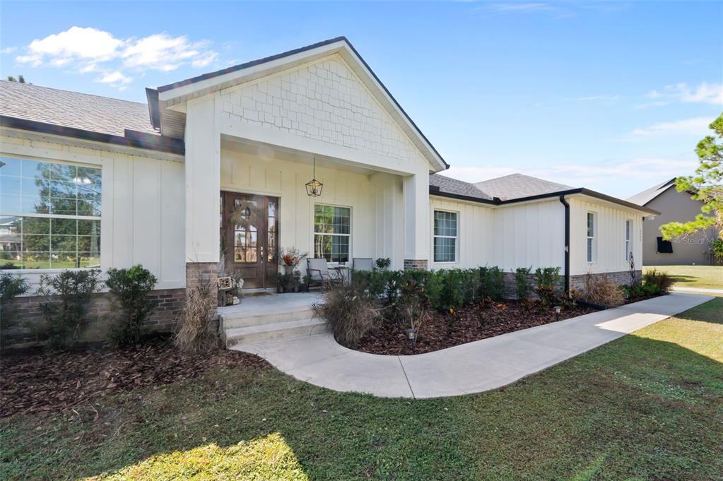 3262 Pheasant Trail Mims, FL 32754 - Photo 68 of 79 a view of a house with backyard and plants
