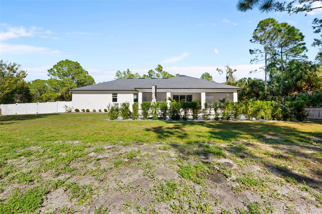3262 Pheasant Trail Mims, FL 32754 - Photo 72 of 79 a front view of a house with a yard