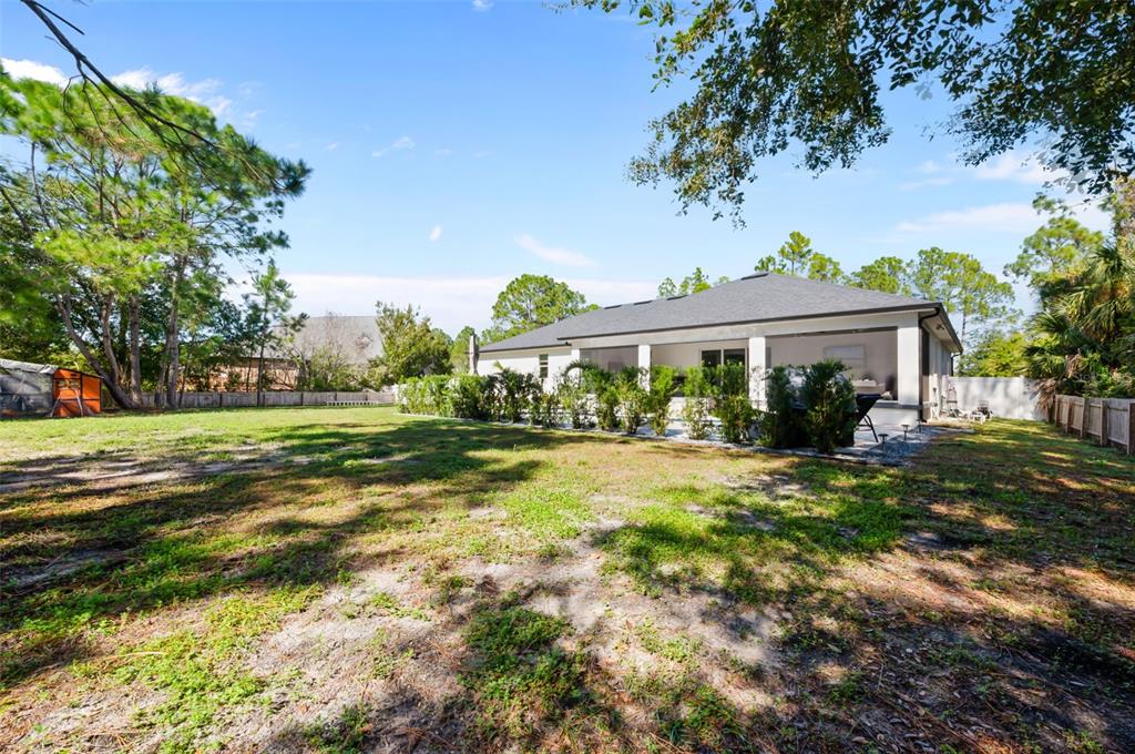 3262 Pheasant Trail Mims, FL 32754 - Photo 73 of 79 a view of a house with a yard