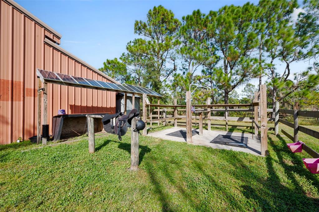 3262 Pheasant Trail Mims, FL 32754 - Photo 79 of 79 a view of a backyard with table and chairs with wooden fence and plants