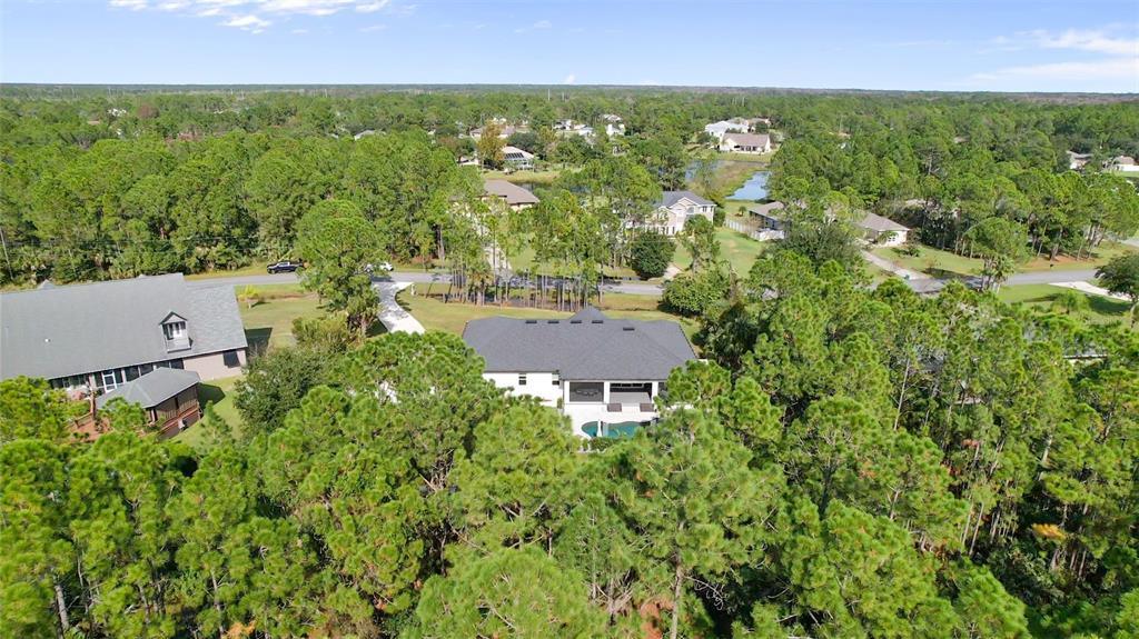 3262 Pheasant Trail Mims, FL 32754 - Photo 8 of 79 an aerial view of residential house with outdoor space and trees all around