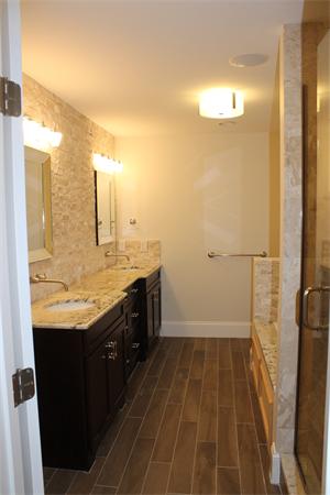 136 Tudor Road Needham, MA 02492 - Photo 18 of 18 a bathroom with a granite countertop sink a toilet and shower