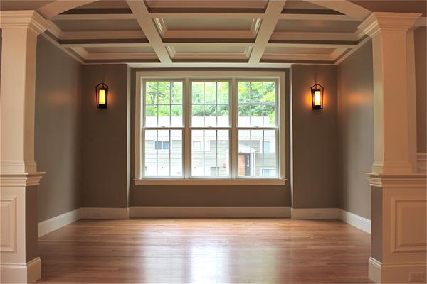136 Tudor Road Needham, MA 02492 - Photo 3 of 18 a view of an empty room with wooden floor and a window