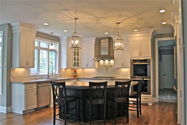 136 Tudor Road Needham, MA 02492 - Photo 8 of 18 a kitchen with granite countertop a table and chairs in it