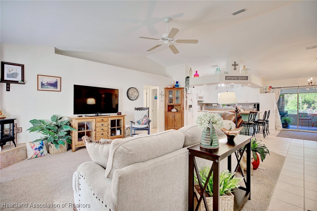4101 Leaf Road Sebring, FL 33875 - Photo 4 of 34 a living room with furniture and a flat screen tv