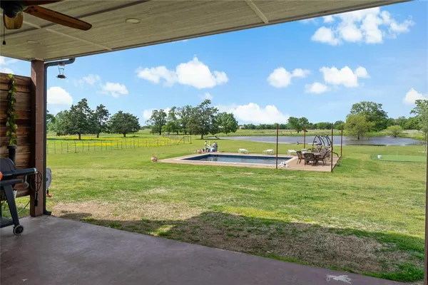 a view of a golf course with a lake
