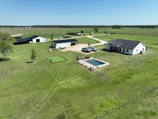 a view of a green field with clear sky