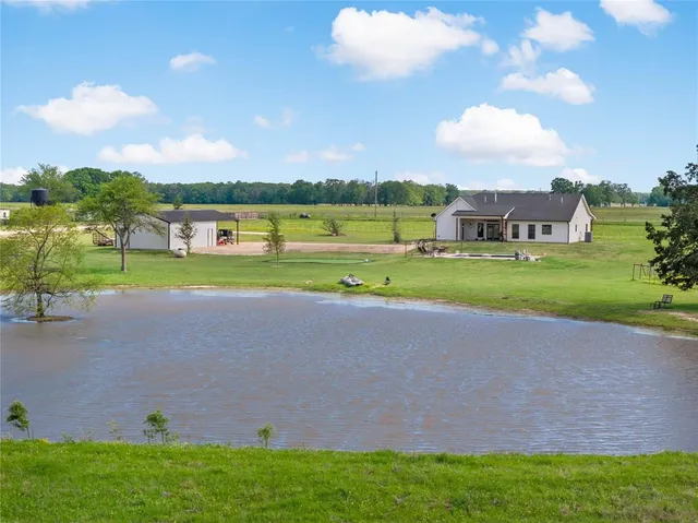 a view of a golf course with a lake