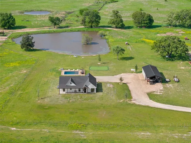 a view of a lake with a yard