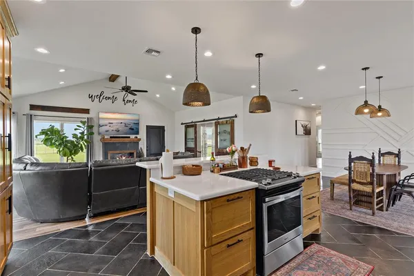 a kitchen that has a lot of cabinets in it