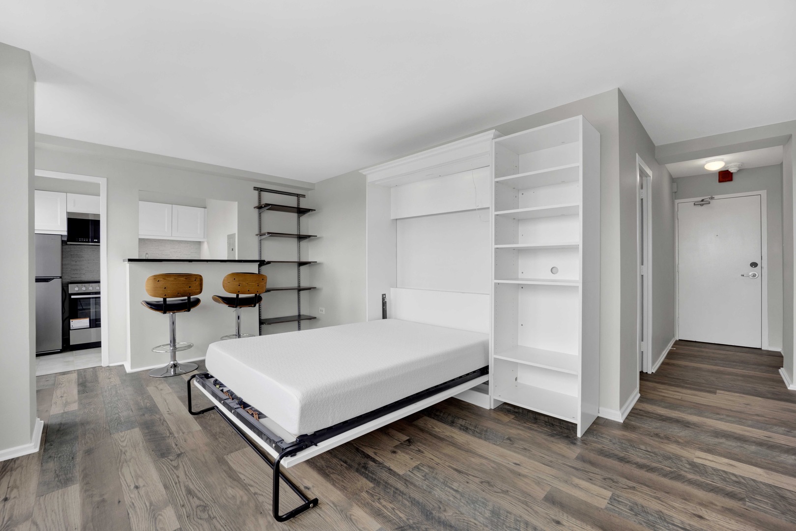 6030 North Sheridan Road, Unit 1307 Chicago, IL 60660 - Photo 7 of 18 a bedroom with furniture and a wooden floor