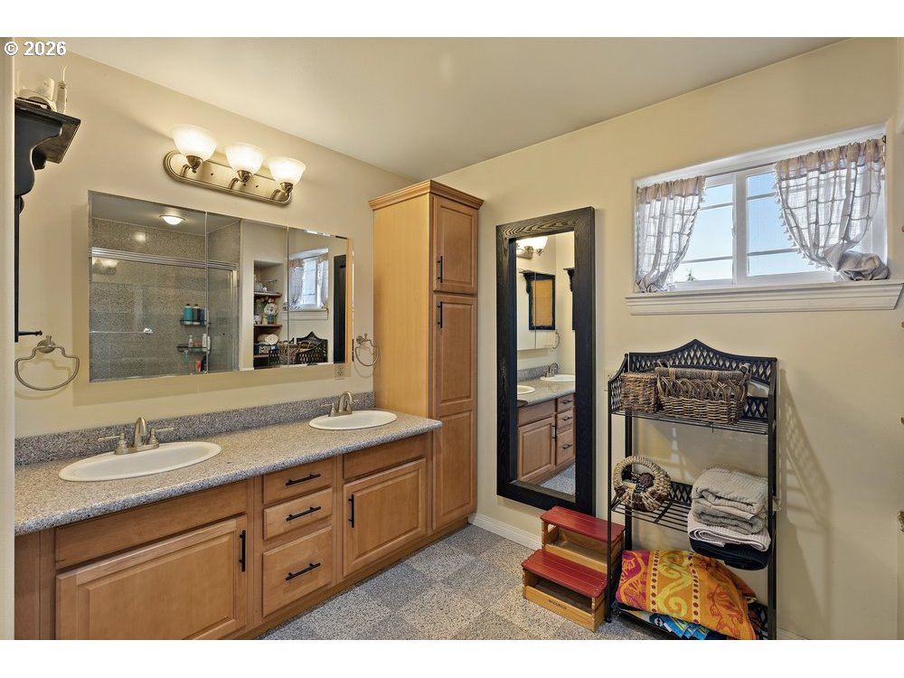 500 St Hilaire Road Yakima, WA 98901 - Photo 14 of 29 a bathroom with a sink a vanity and a mirror