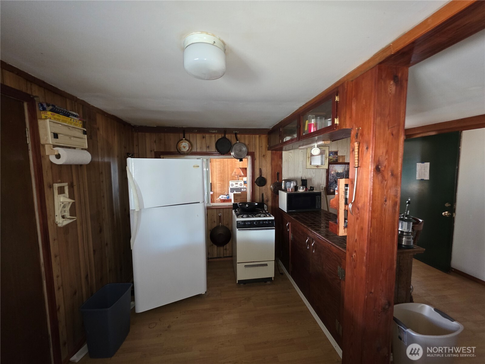 105 Emily Road Oroville, WA 98844 - Photo 13 of 24 a kitchen with stainless steel appliances granite countertop a refrigerator a stove and a sink