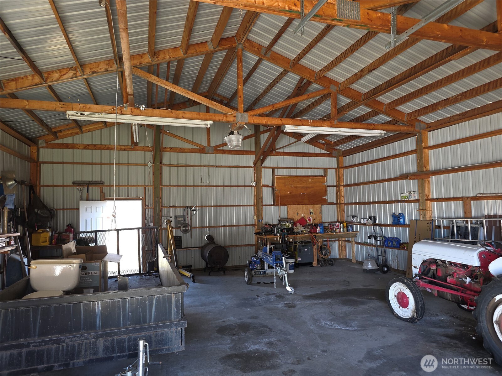 105 Emily Road Oroville, WA 98844 - Photo 16 of 24 a view of a storage room with racks on the wall
