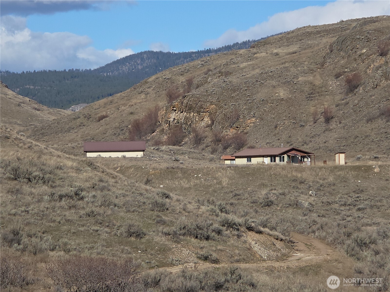 105 Emily Road Oroville, WA 98844 - Photo 19 of 24 a view of outdoor space and mountain view